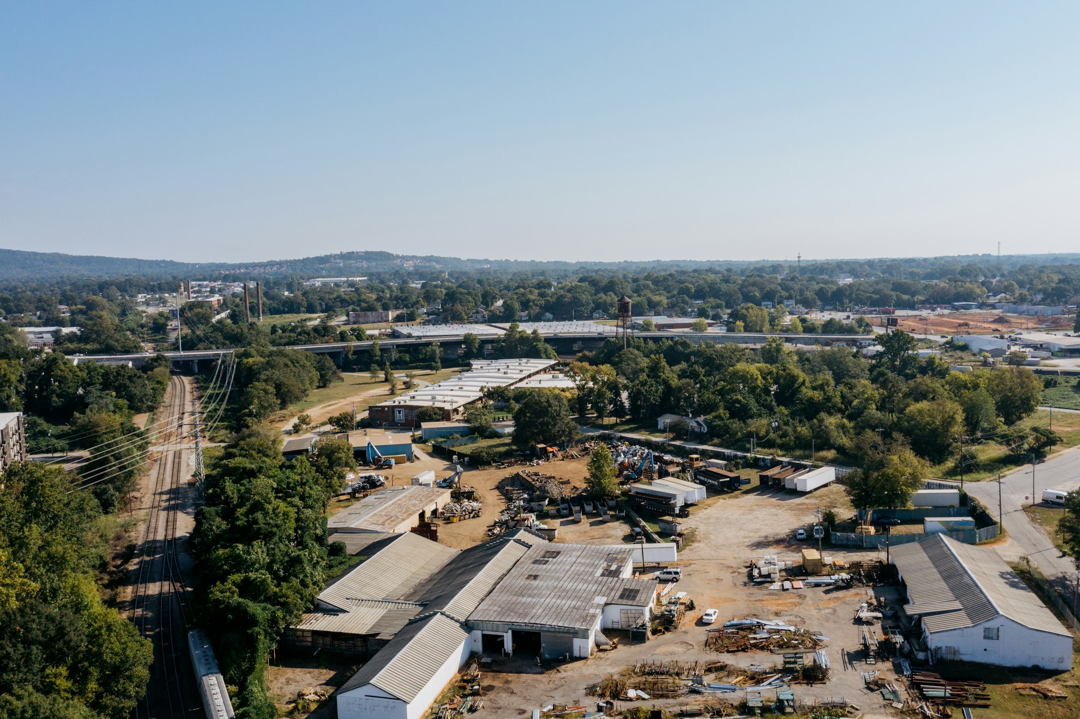 Aerial view of industrial land with yards, buildings, and parcel boundaries